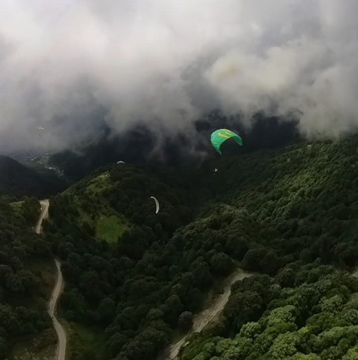 Beautiful view of valley while flying through the clouds